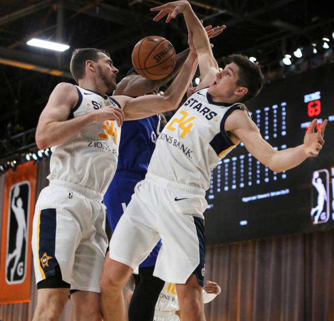 Salt Lake City Stars' Tyler Cavanaugh (34), left, Delaware Blue Coats' Cameron Oliver (0) and S ...