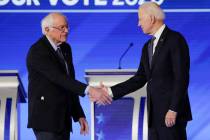 Democratic presidential candidates Sen. Bernie Sanders, I-Vt., left, and former Vice President ...