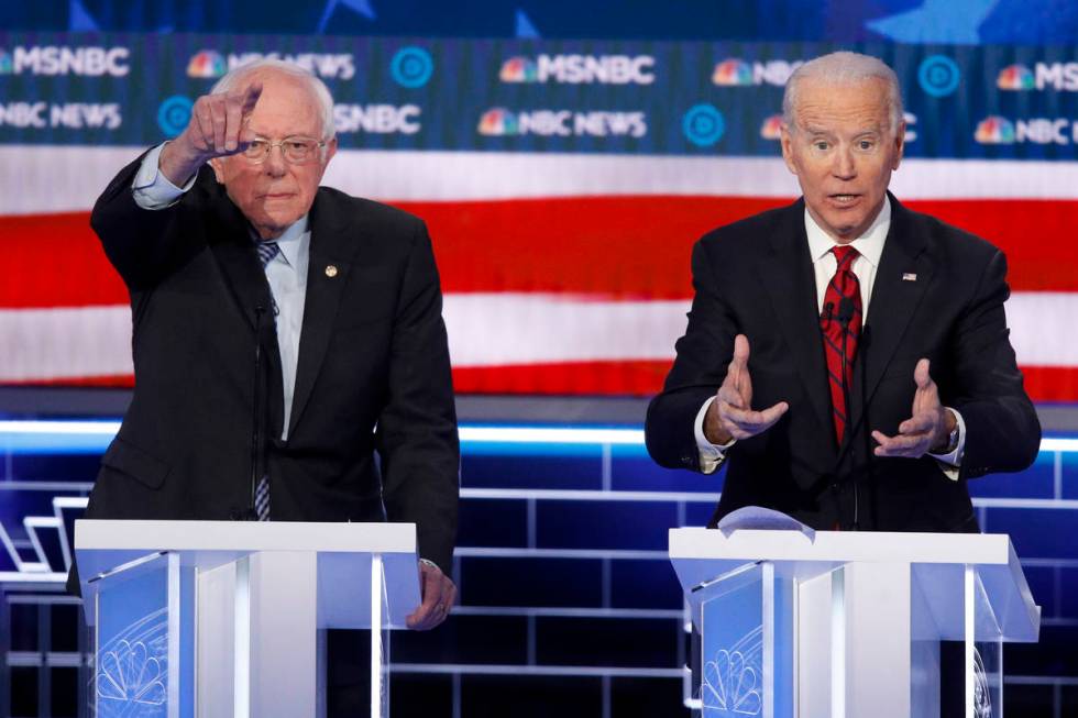 Democratic presidential candidates, Sen. Bernie Sanders, I-Vt., left, and former Vice President ...