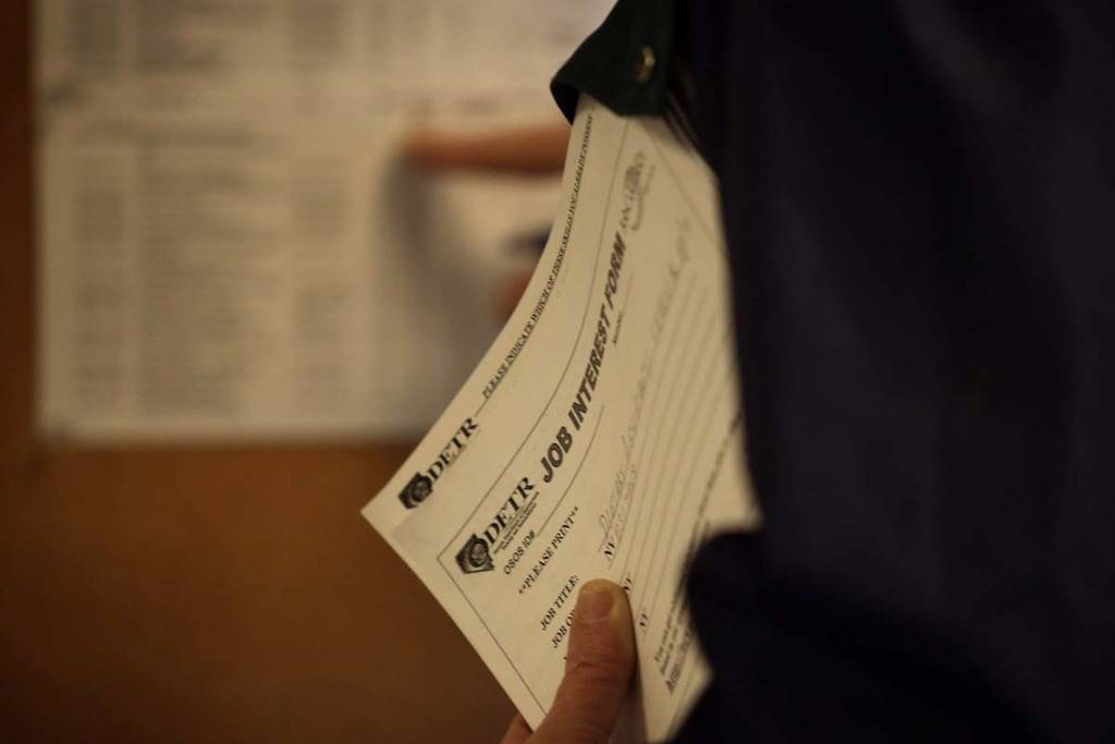 A man looks at an employment board at Nevada JobConnect, 119 South Water St., Henderson, Thursd ...