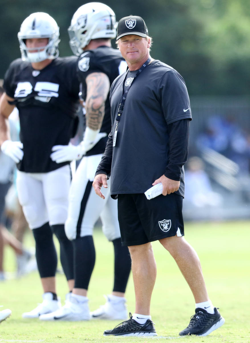 Oakland Raiders head coach Jon Gruden watches as his team drills during a joint NFL training ca ...