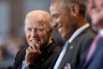 In a Jan. 4, 2017, file photo, Vice President Joe Biden, left, watches President Barack Obama, ...