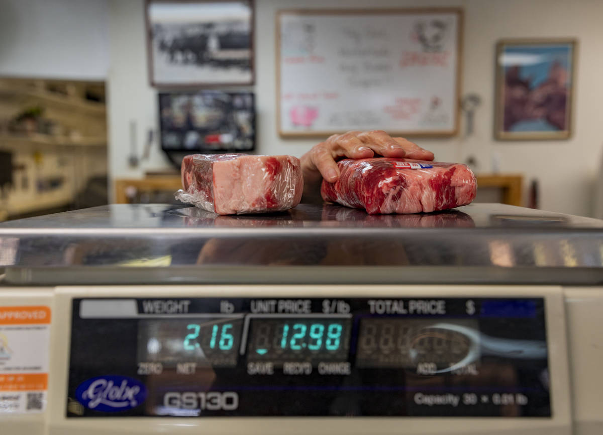 Ribeye steaks are weighed at Village Meat & Wine, an old fashioned butcher shop, in Las Veg ...