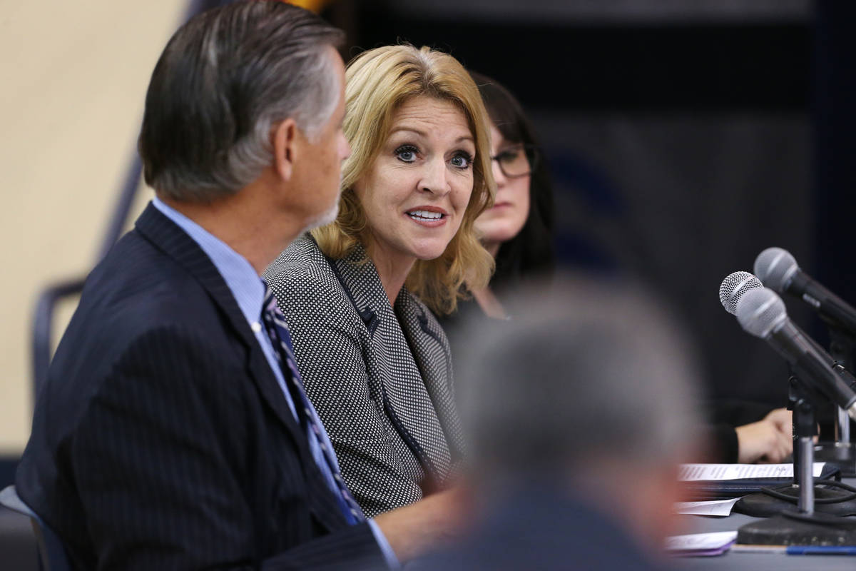 Dr. Diane Gullett, center, deputy superintendent for the Clark County School District, speaks d ...