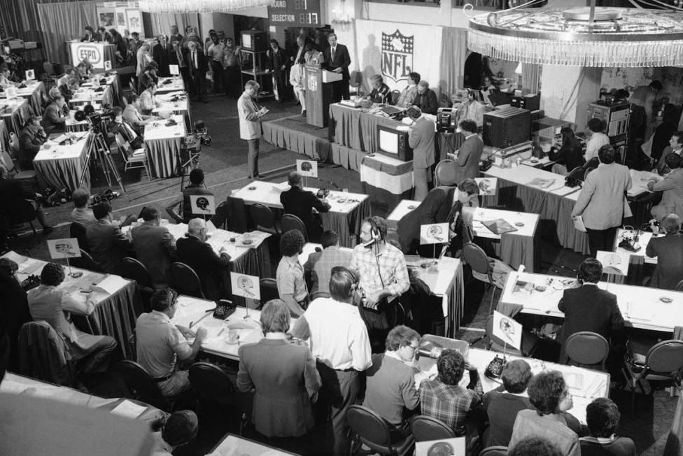 Football commissioner Pete Rozelle stands at the podium, Tuesday, April 29, 1980 in New York as ...