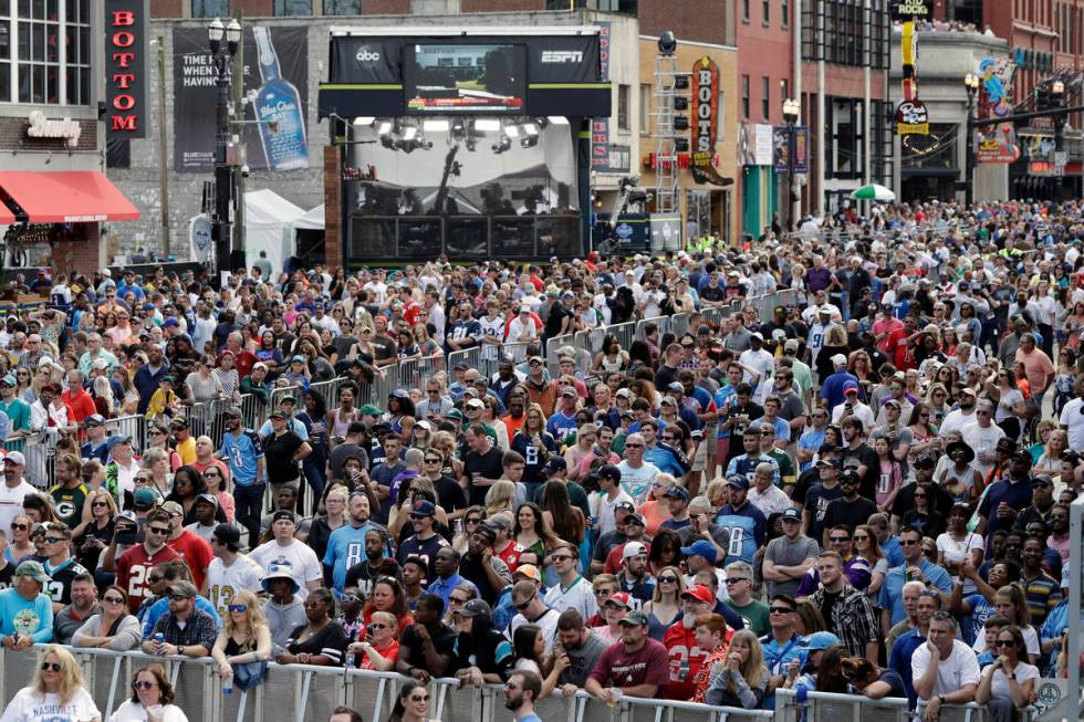 FILE - In this April 27, 2019, file photo, fans attend the final day of the NFL football draft ...