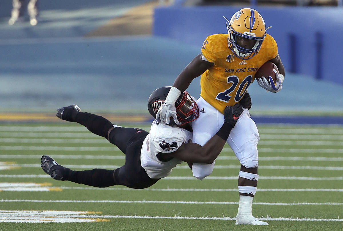 San Jose State running back Malike Roberson (20) runs agains UNLV linebacker Javin White during ...