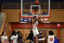 Bishop Gorman forward Mwani Wilkinson (23) blocks a shot by in the Durango guard Keshon Gilbert ...