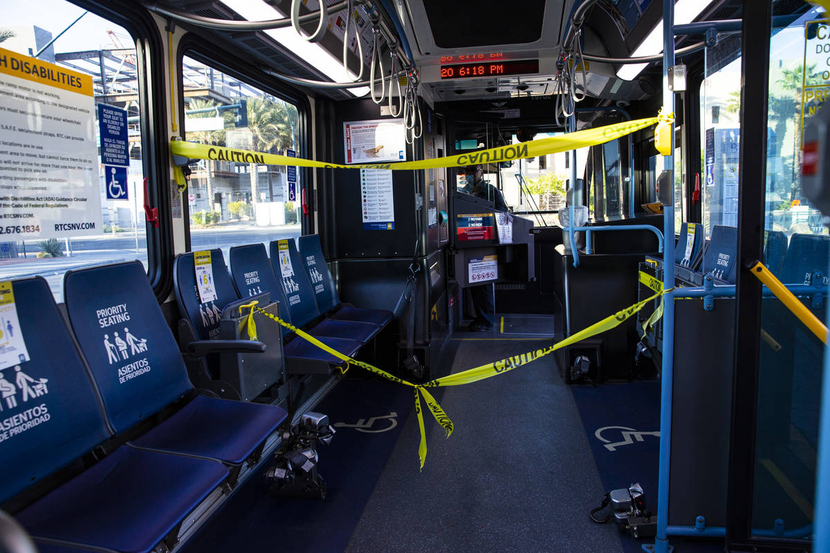 Caution tape, which allows extra distance between the bus driver and passengers, is seen on a R ...