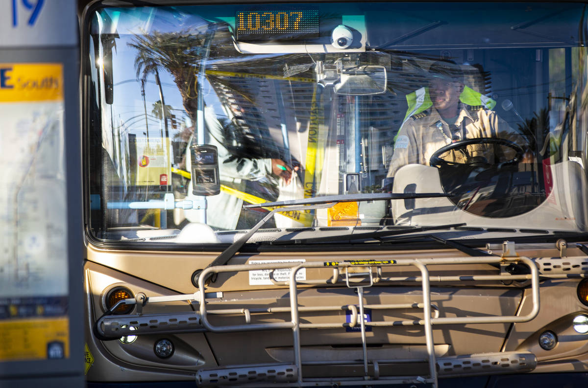 A Regional Transportation Commission bus driver waits as passengers board the double-decker Deu ...