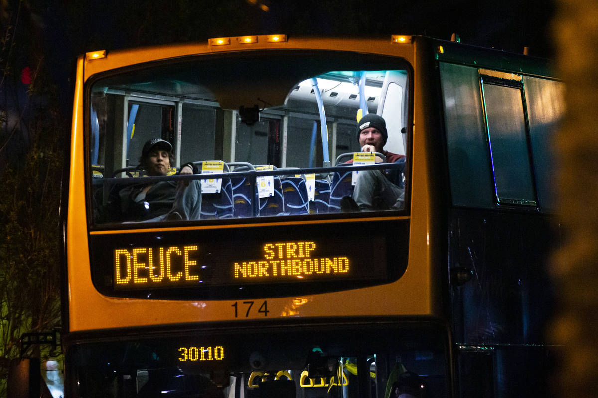 Passengers sit apart in a Regional Transportation Commission Deuce bus along Casino Center Boul ...