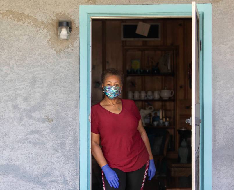 Kismet Evans stand for a portrait in her doorway on Thursday, April 16, 2020, in Las Vegas. Eva ...