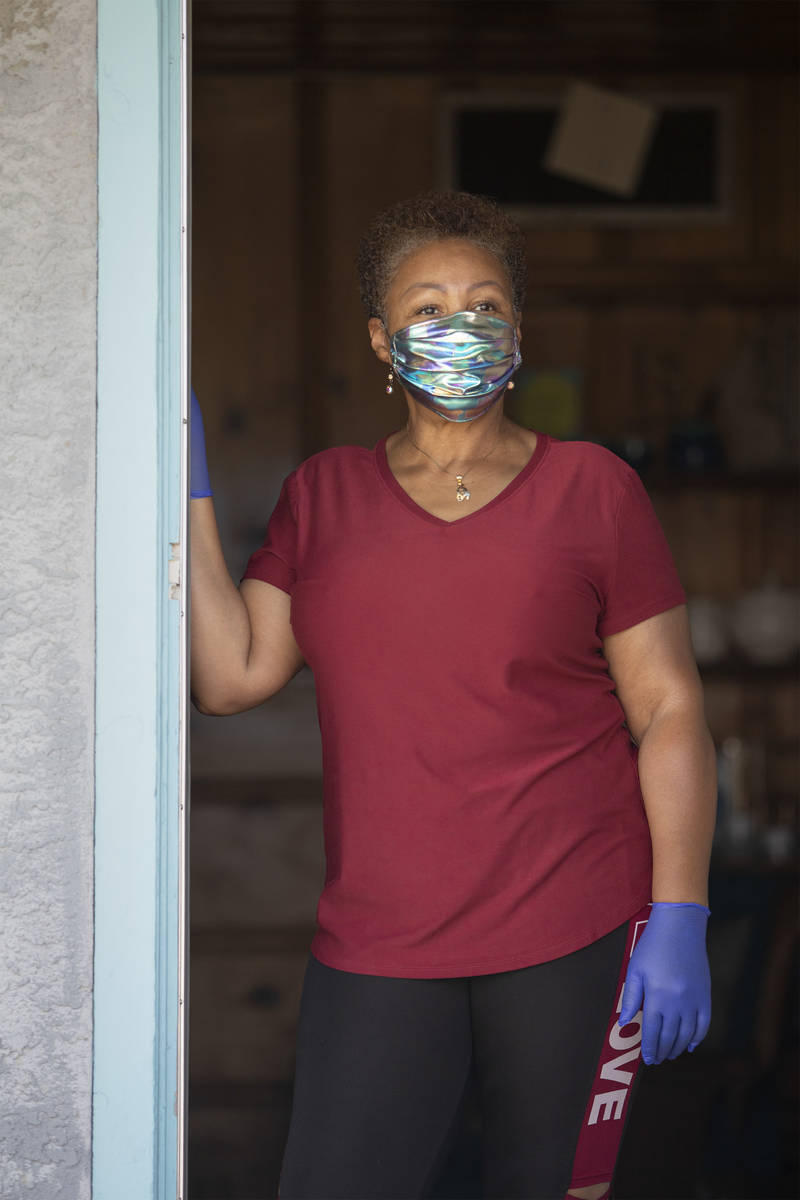 Kismet Evans stand for a portrait in her doorway on Thursday, April 16, 2020, in Las Vegas. Eva ...