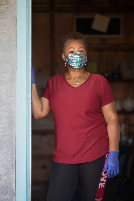 Kismet Evans stand for a portrait in her doorway on Thursday, April 16, 2020, in Las Vegas. Eva ...