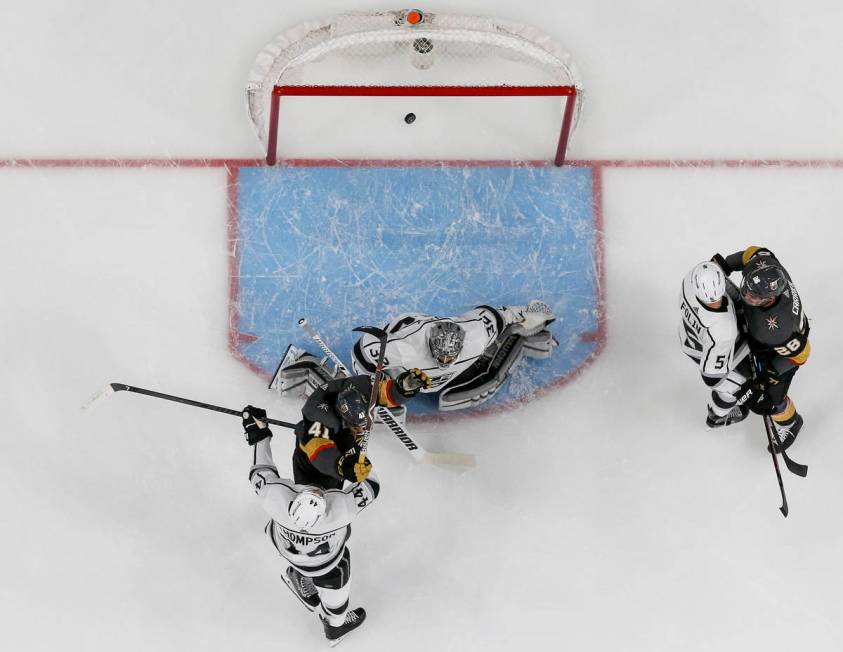 A goal shot by Vegas Golden Knights defenseman Shea Theodore (27) gets past Los Angeles Kings g ...