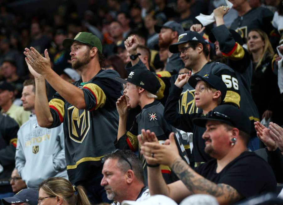 Golden Knights fans shout to Los Angeles Kings players during the second period of Game 1 of an ...