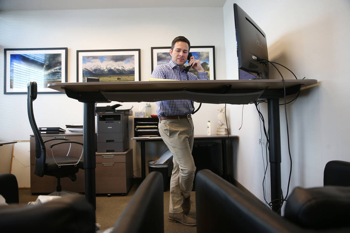 Attorney Michael Cahill makes a call to a client at his law office in Las Vegas, Friday, April ...