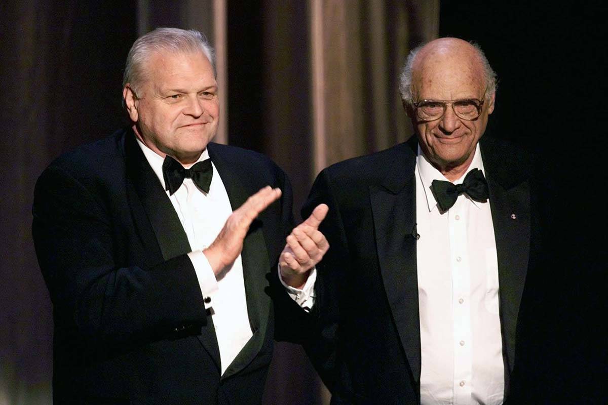 Actor Brian Dennehy, left, applauds playwright, Arthur Miller, before awarding him the Lifetime ...