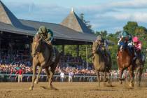 FILE- In this Aug. 24, 2019, file photo, Code of Honor, left, with jockey John Velazquez, leads ...