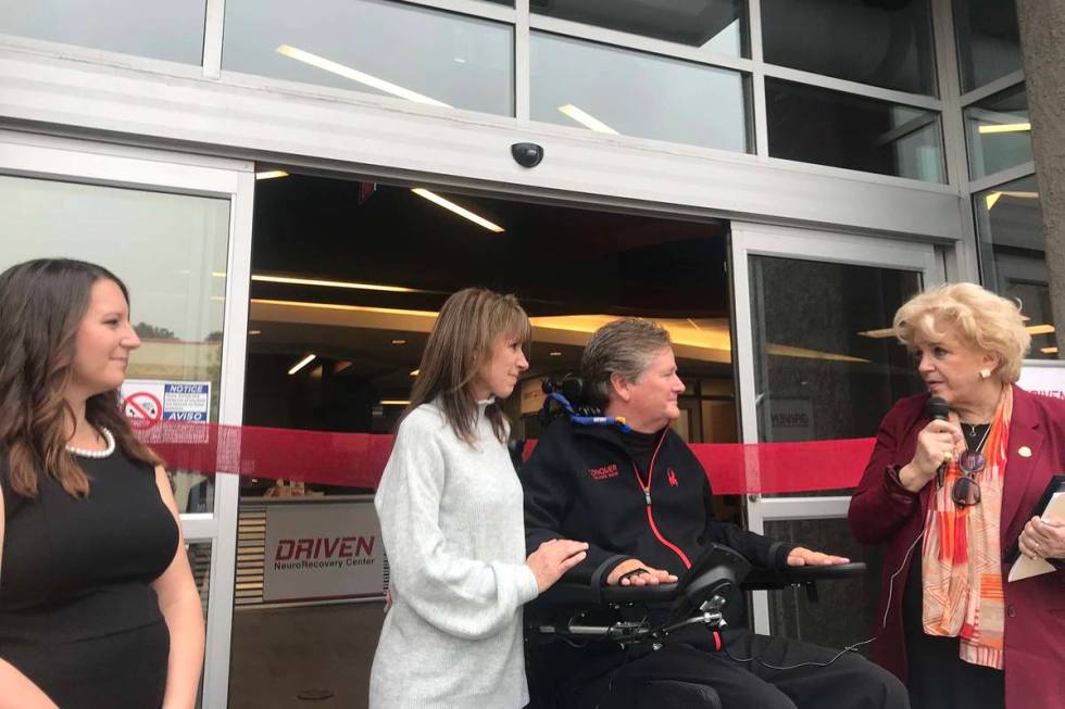 Sam Schmidt, founder of DRIVEN NeuroRecovery Center, poses with his wife, Sheila, and the cente ...