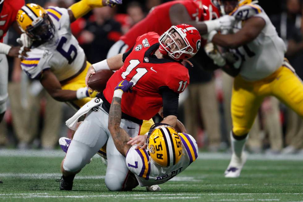 LSU safety Grant Delpit (7) sacks Georgia quarterback Jake Fromm (11) during the first half of ...