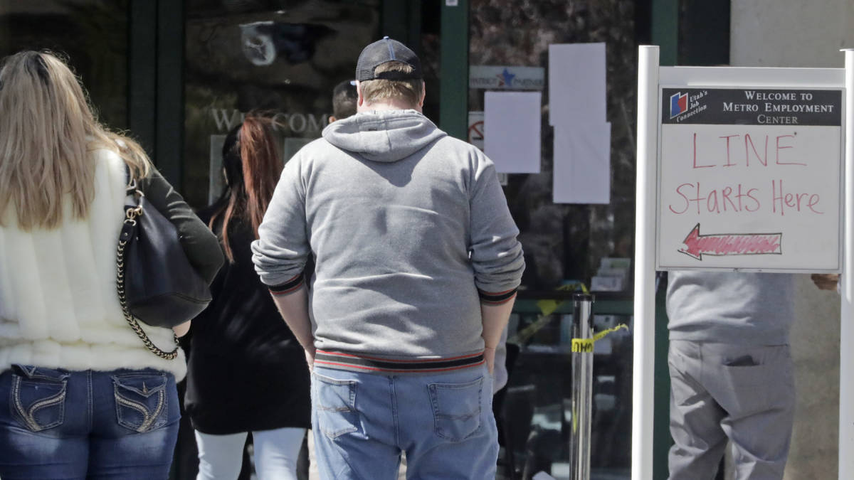 People line up outside the Utah Department of workforce Services Monday, April 13, 2020, in Sal ...