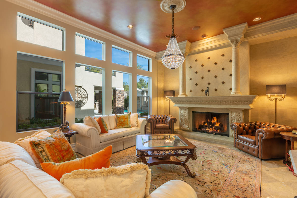 The home's living room off the entry is features a traditional fireplace. (Tom Love Group)