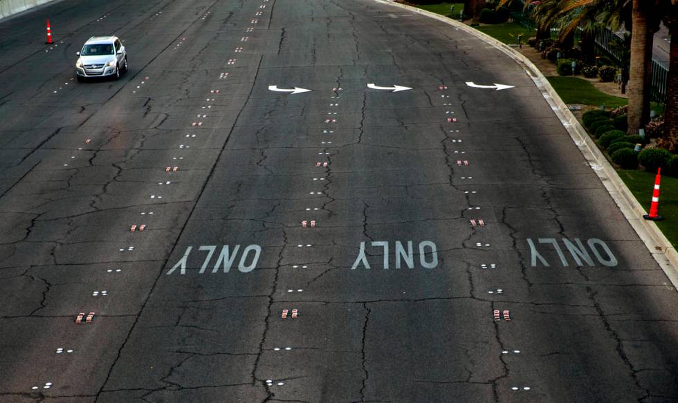 A lone vehicle moves past New-York New-York along Las Vegas Boulevard on the Strip Wednesday, A ...