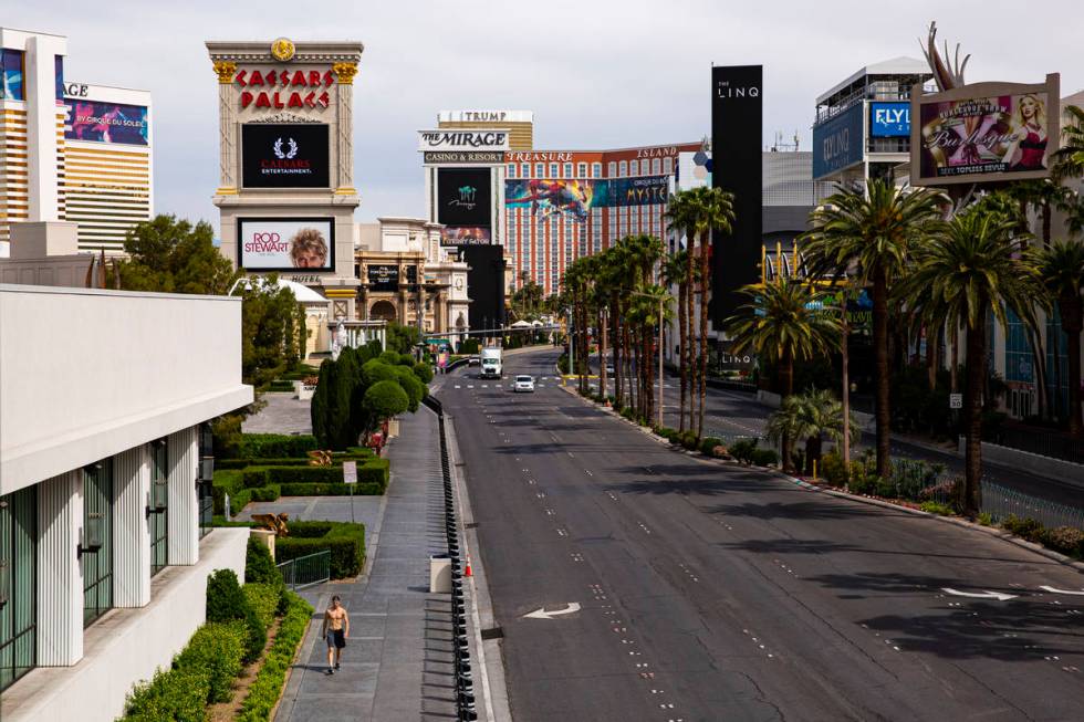 A man walks along the Las Vegas Strip on Thursday, April 16, 2020. (Chase Stevens/Las Vegas Rev ...