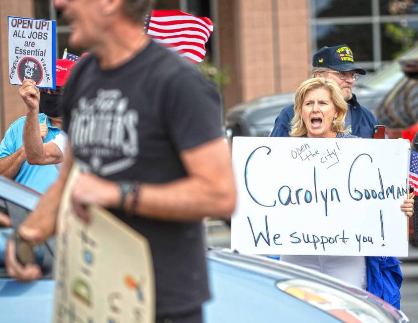Sue Thiel, right, takes part in a protest outside the Grant Sawyer State Office Building organi ...