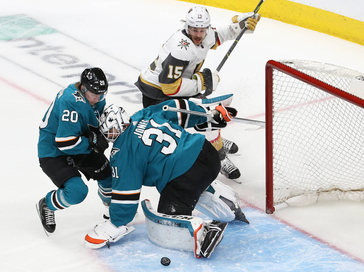 San Jose Sharks goaltender Martin Jones (31) makes a save against Knights defenseman Jon Merril ...