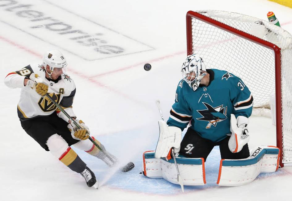 San Jose Sharks goaltender Martin Jones (31) makes a save against Knights right wing Reilly Smi ...