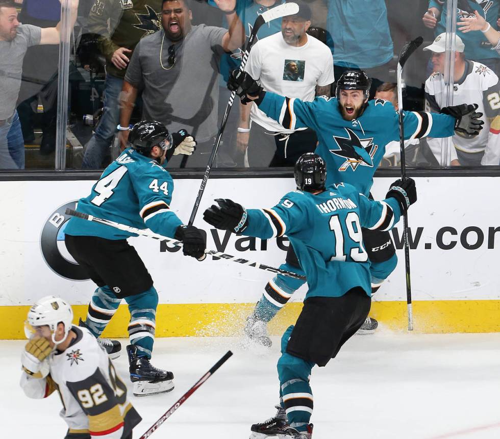 Sharks right wing Barclay Goodrow (23) celebrates with Sharks defenseman Marc-Edouard Vlasic (4 ...