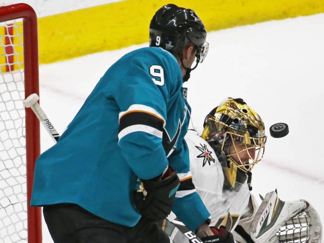 Golden Knights goaltender Marc-Andre Fleury (29) makes a save against Sharks left wing Evander ...