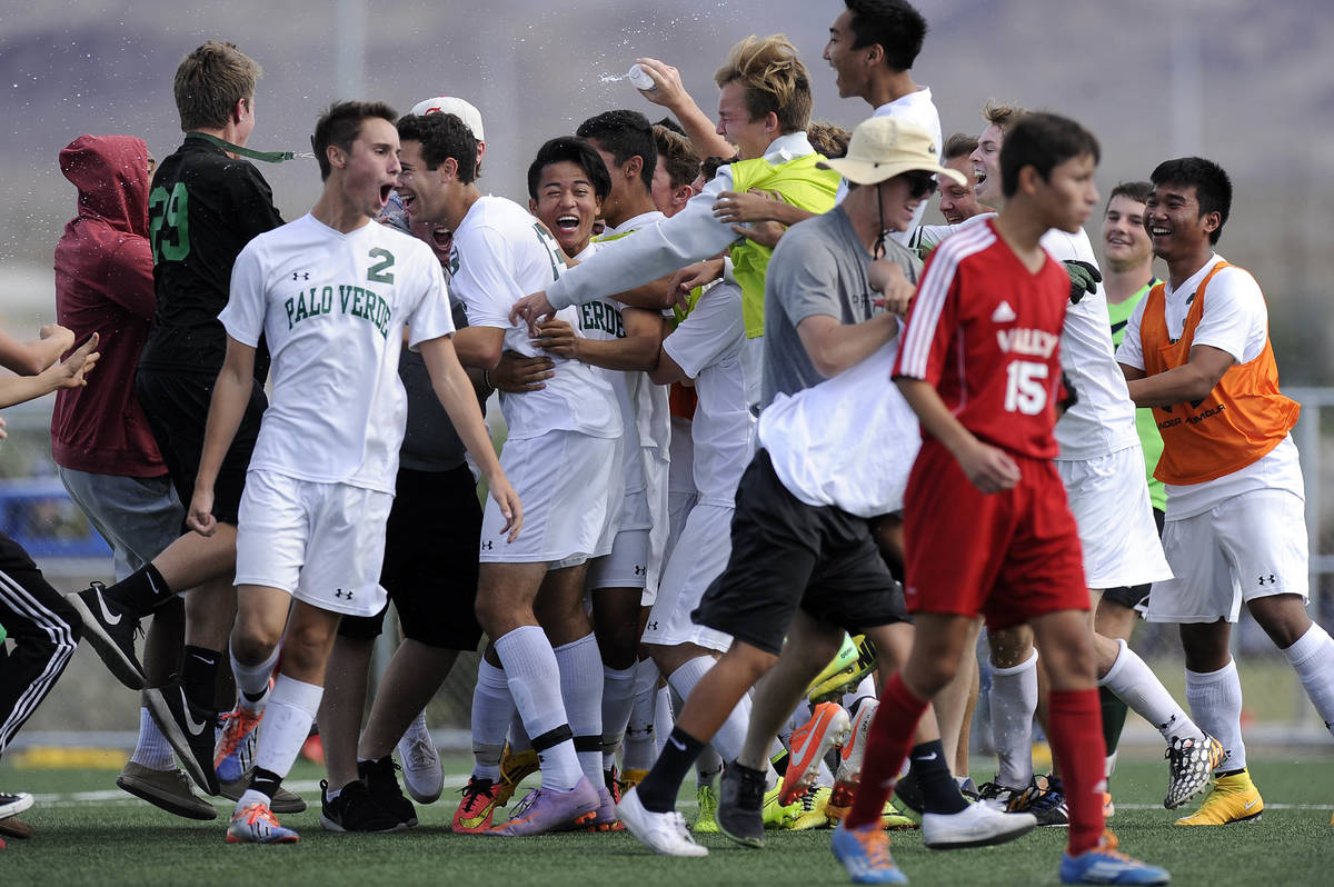 Palo Verde players celebrate their 2-1 victory over Valley in the Division I boys state soccer ...