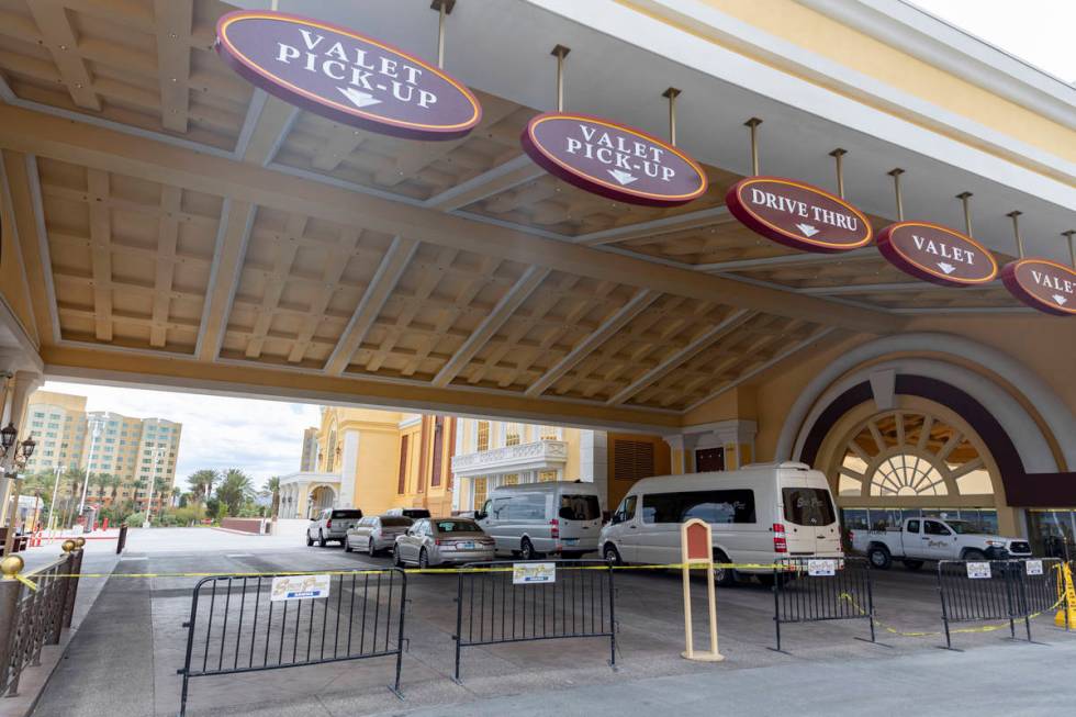 Caution tape and barriers block the valet and drive thru entrance of South Point while temporar ...