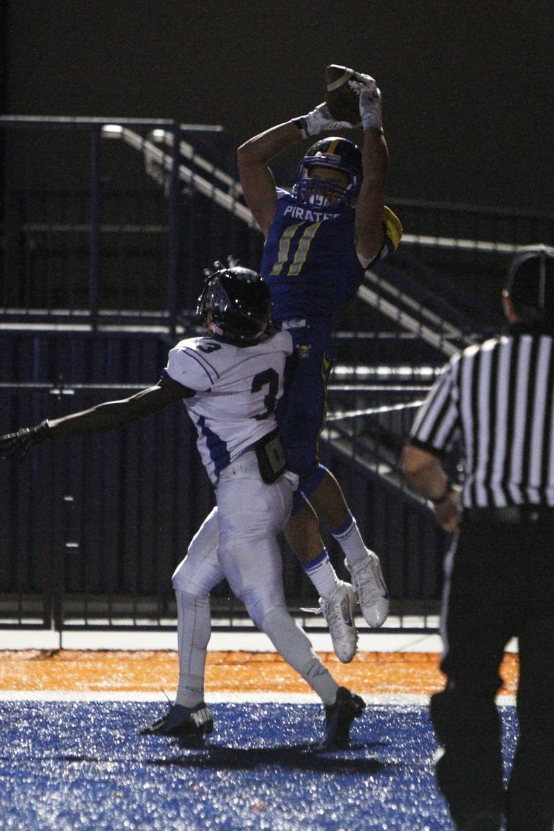 Moapa Valley wide receiver R.J. Hubert pulls in the game winning touchdown while being covered ...