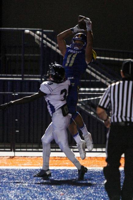 Moapa Valley wide receiver R.J. Hubert pulls in the game winning touchdown while being covered ...