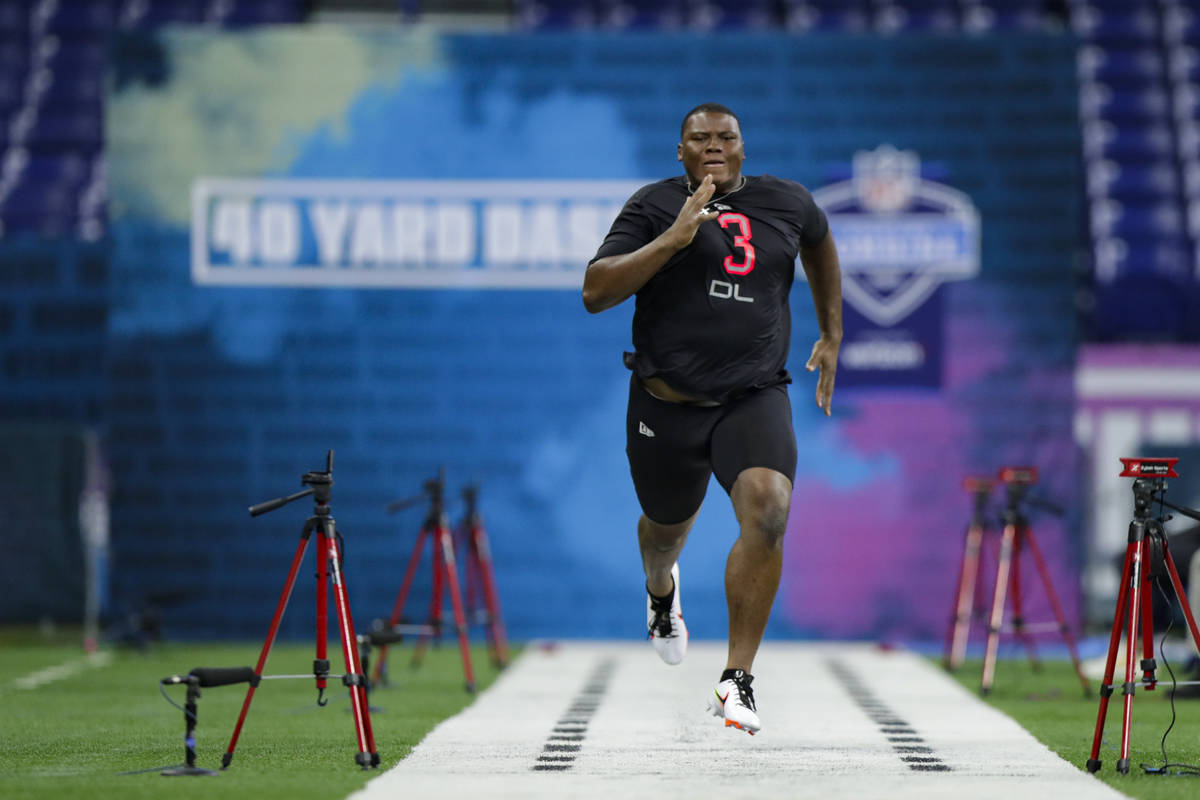 Auburn defensive lineman Derrick Brown runs the 40-yard dash at the NFL football scouting combi ...