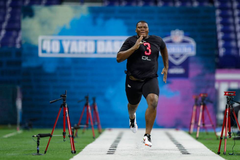 Auburn defensive lineman Derrick Brown runs the 40-yard dash at the NFL football scouting combi ...