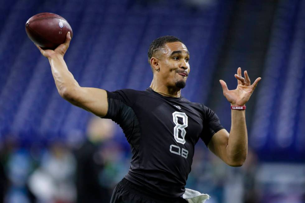 FILE - In this Feb. 27, 2020, file photo, Oklahoma quarterback Jalen Hurts runs a drill at the ...