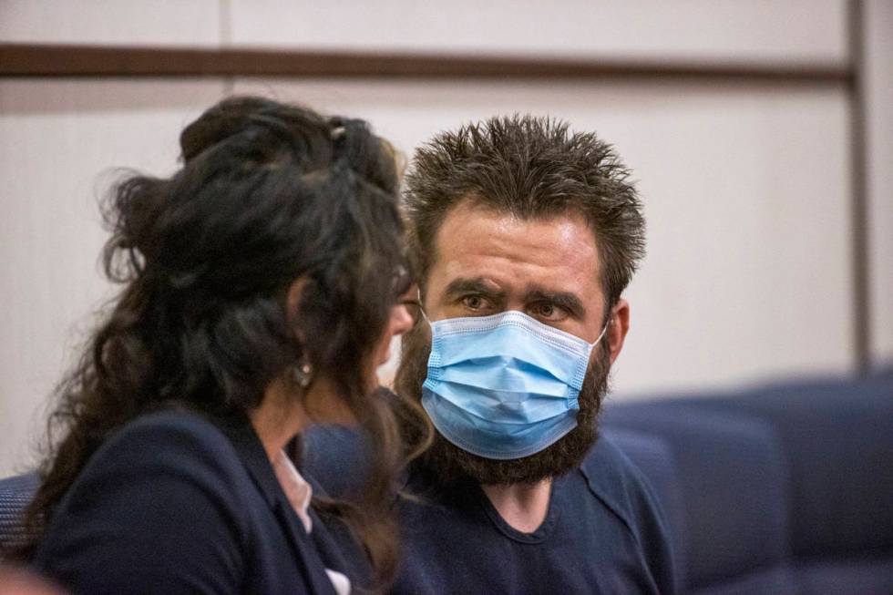 Joshua Nichols, right, confers with his lawyer Julie Raye during his hearing at Henderson Justi ...