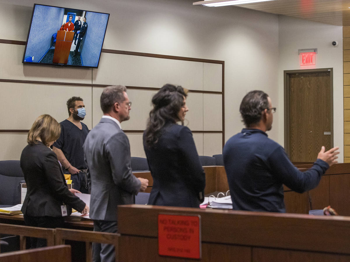 Joshua Nichols, left, listens to lawyers during a hearing with co-defendant George Moya on vide ...