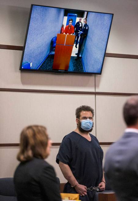 Joshua Nichols, center, appears with co-defendant George Moya on video feed, above, during thei ...