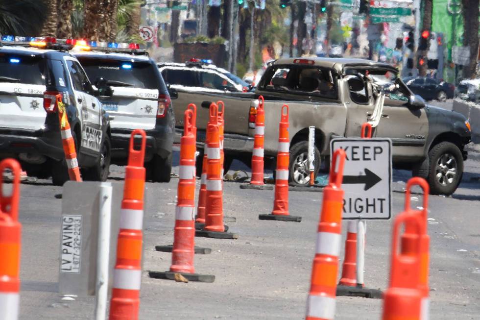 Police investigate a rollover crash on the Las Vegas Strip between Spring Mountain Road and Sah ...