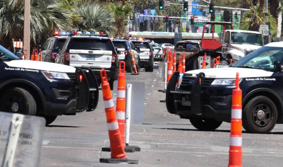 Police investigate a rollover crash on the Las Vegas Strip between Spring Mountain Road and Sah ...