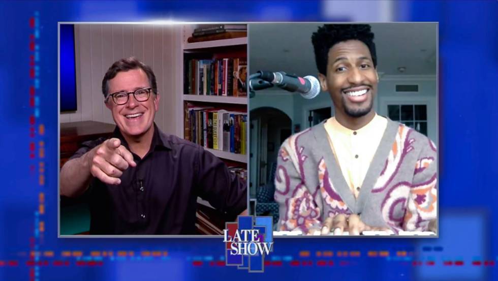 Stephen Colbert, left, and bandleader Jon Batiste are shown during an episode of "The Late Show ...