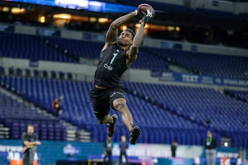 Ohio State defensive back Damon Arnette runs a drill at the NFL football scouting combine in In ...