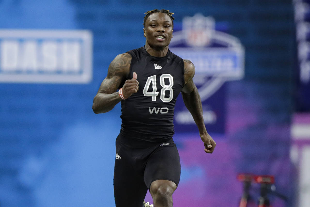 Alabama wide receiver Henry Ruggs III runs the 40-yard dash at the NFL football scouting combin ...