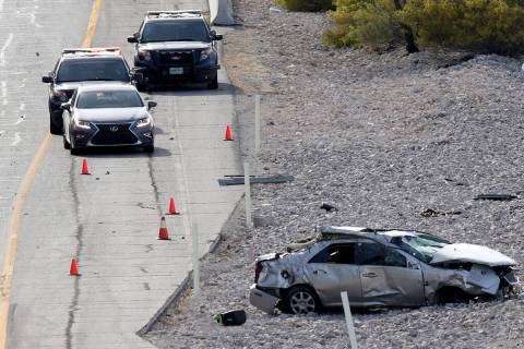The scene of a fatal car crash on Summerlin Parkway near Anasazi Drive in Las Vegas, Thursday, ...